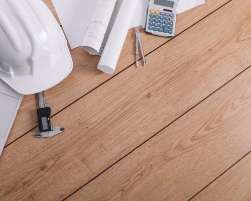 laptop-near-helmet-blueprints